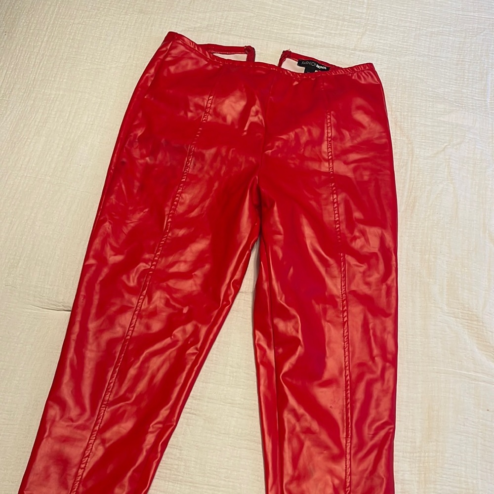 Red faux leather bottoms.